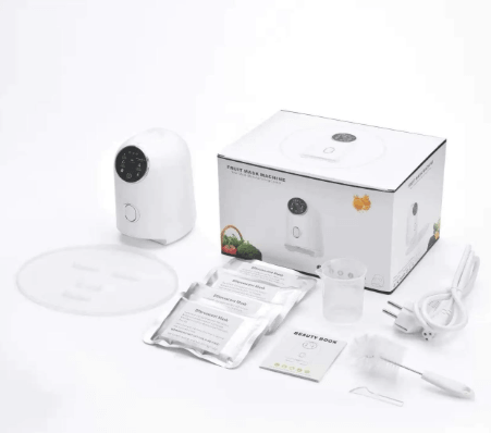DIY Face Mask Machine kit including device, bowl, ingredients, and accessories for natural glowing skin.